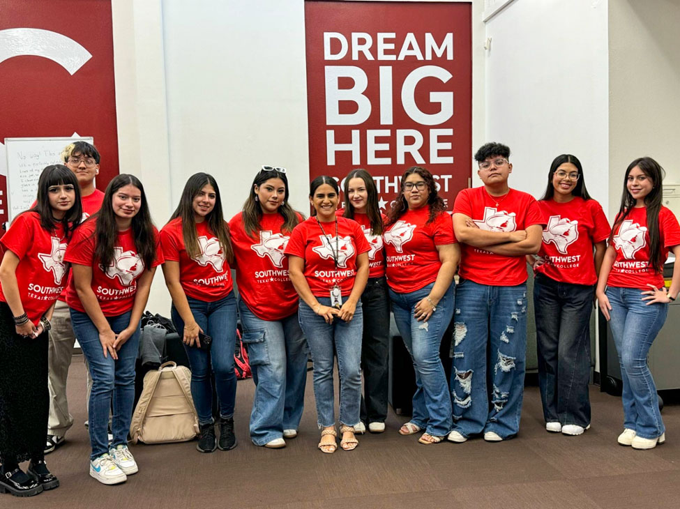 Students pose with English instructor D Rodriguez